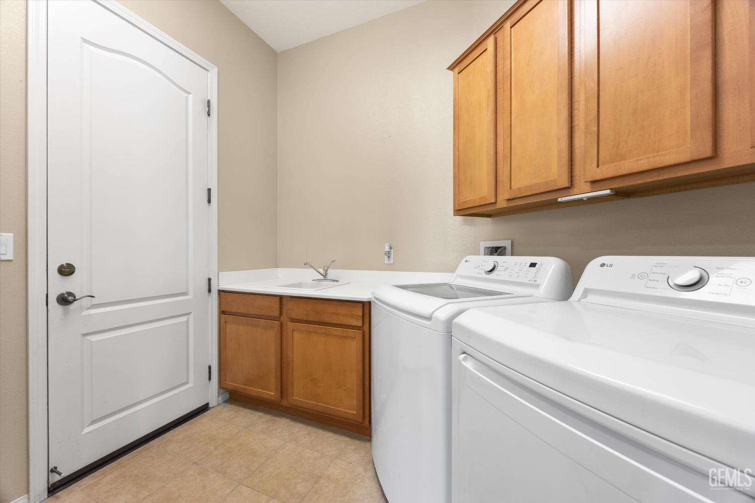 Undisclosed Address Bakersfield, CA 93306 - Photo 28 of 35 a utility room with dryer and washer