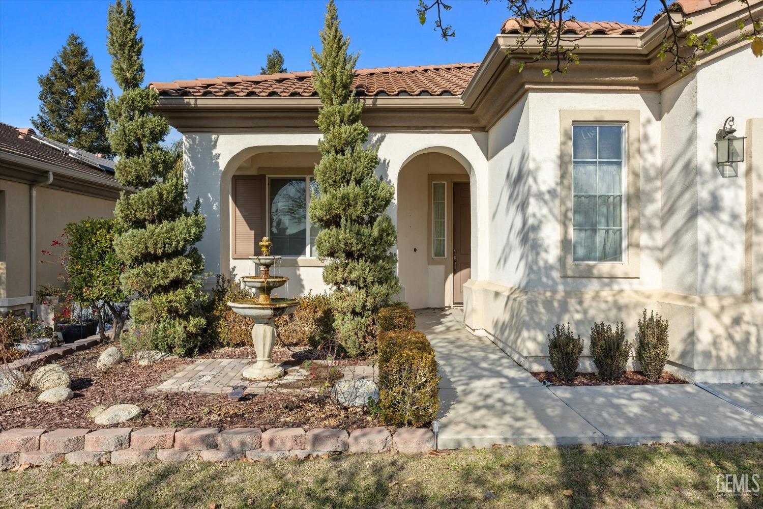 Undisclosed Address Bakersfield, CA 93306 - Photo 4 of 35 a view of a house with fountain and plants