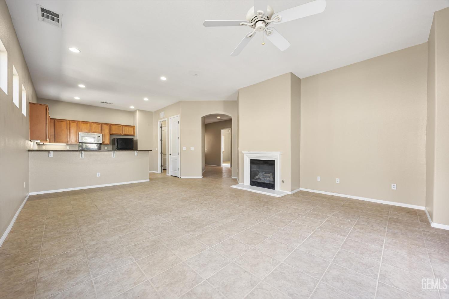 Undisclosed Address Bakersfield, CA 93306 - Photo 10 of 35 a view of a kitchen with a sink and a fireplace