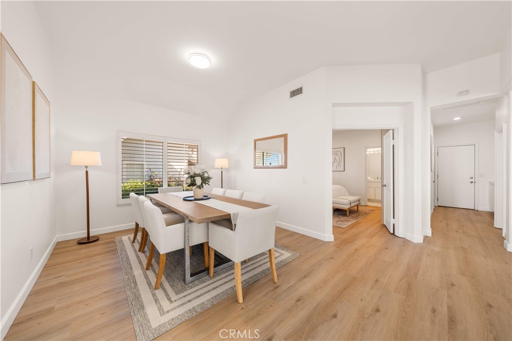 34152 Cambridge Road Dana Point, CA 92629 - Photo 19 of 70 a view of a dining room with furniture window and wooden floor