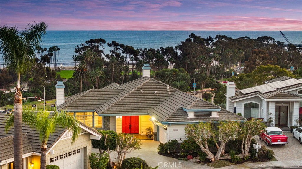 34152 Cambridge Road Dana Point, CA 92629 - Photo 4 of 70 a front view of a house with a yard