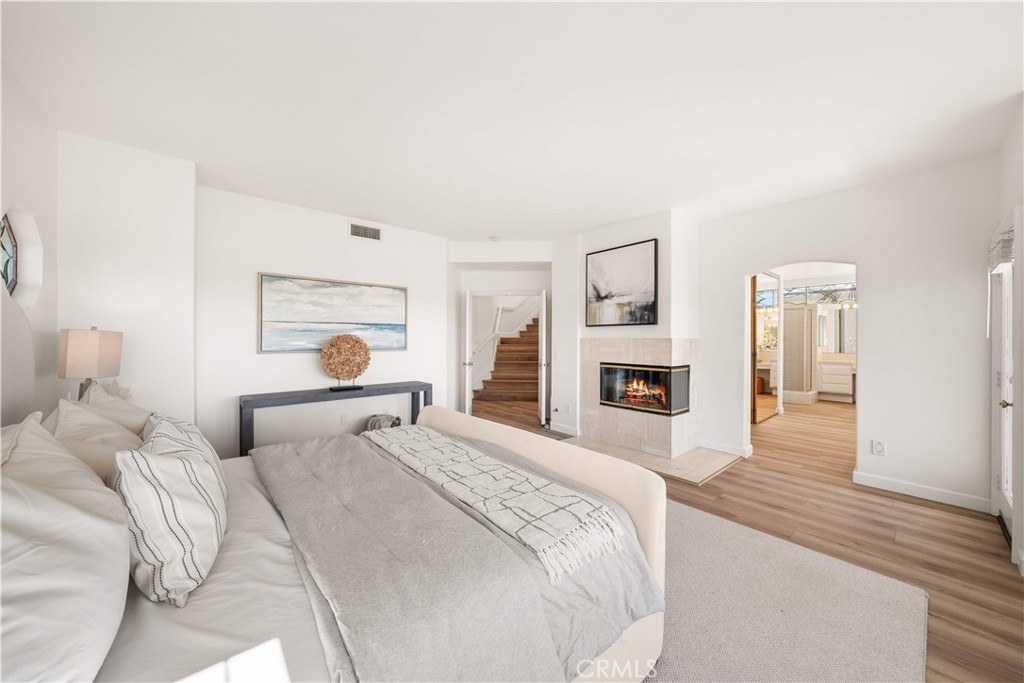 34152 Cambridge Road Dana Point, CA 92629 - Photo 47 of 70 a bedroom with a large bed and a couch