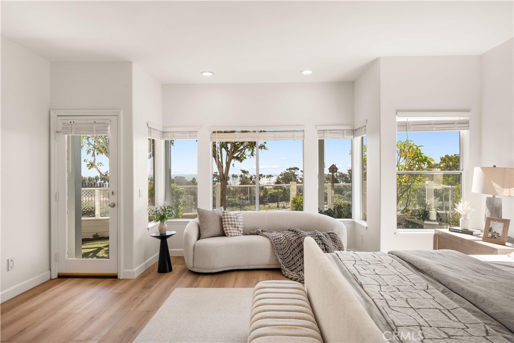 34152 Cambridge Road Dana Point, CA 92629 - Photo 49 of 70 a spacious bedroom with a large bed and a large window