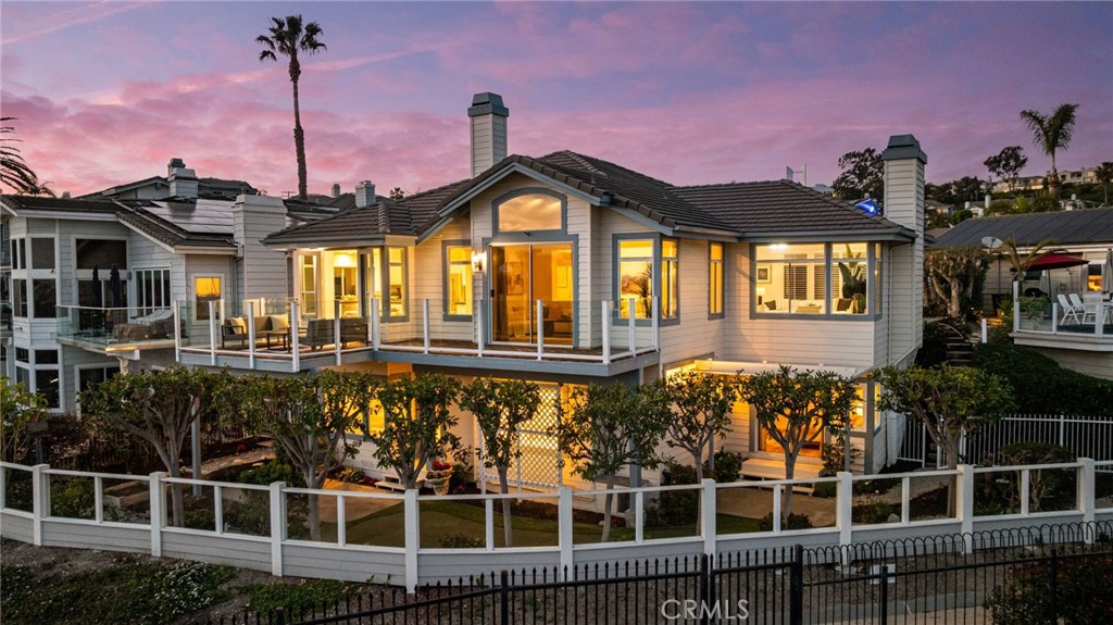 34152 Cambridge Road Dana Point, CA 92629 - Photo 5 of 70 a front view of a house with a garden