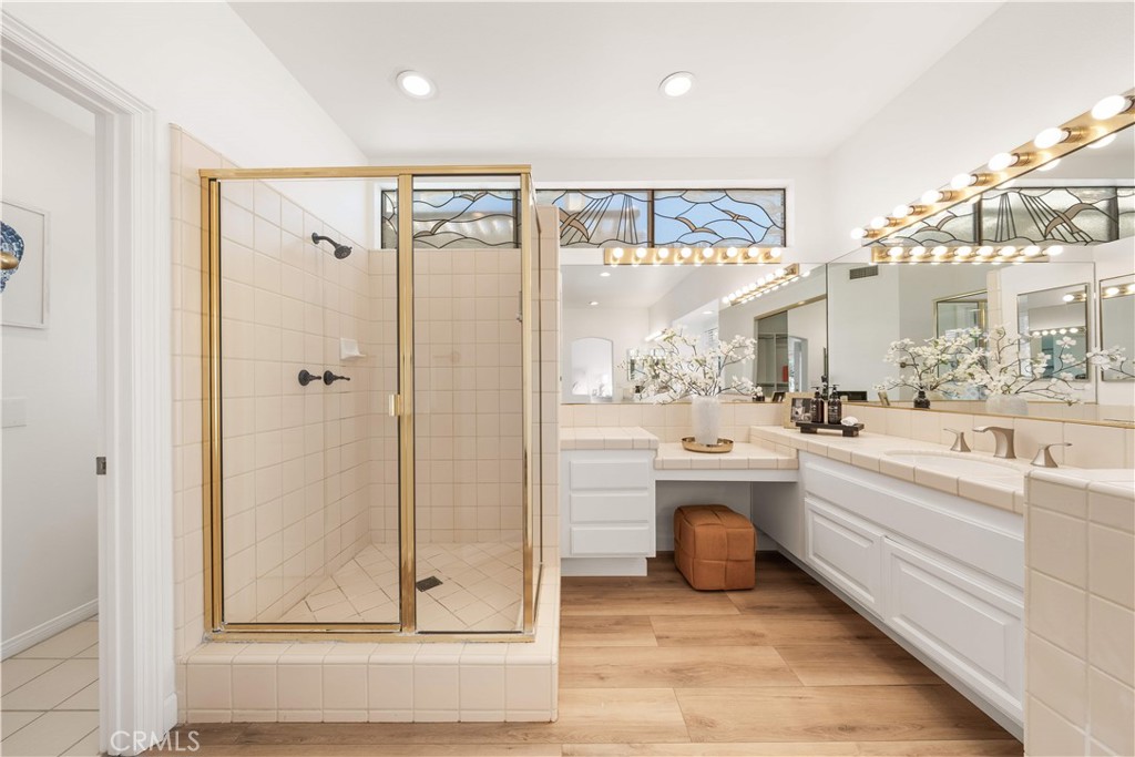 34152 Cambridge Road Dana Point, CA 92629 - Photo 54 of 70 a bathroom with a tub a mirror and shower