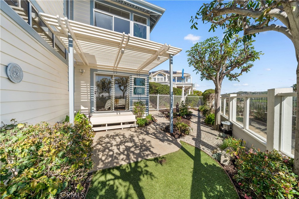 34152 Cambridge Road Dana Point, CA 92629 - Photo 65 of 70 a house with garden in front of it