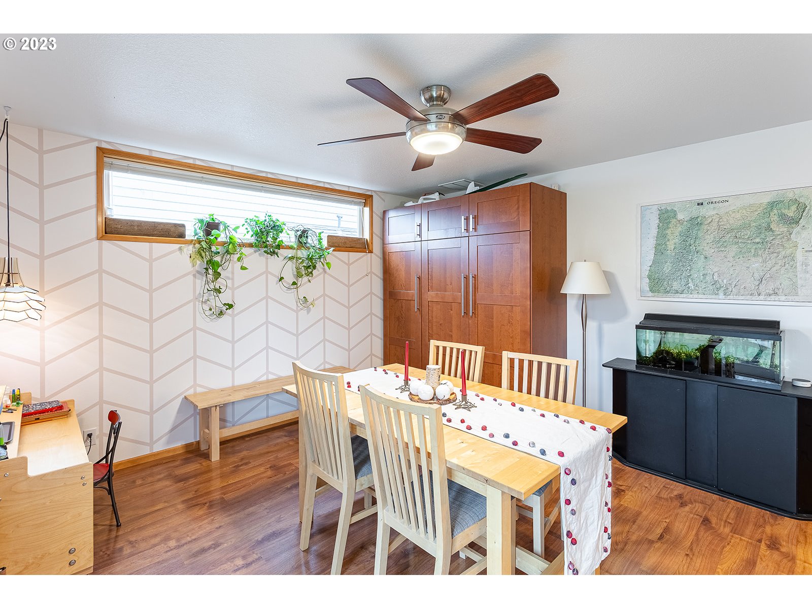 4010 Torrington Avenue Eugene, OR 97404 - Photo 14 of 35 a dining room with furniture a window and a chandelier