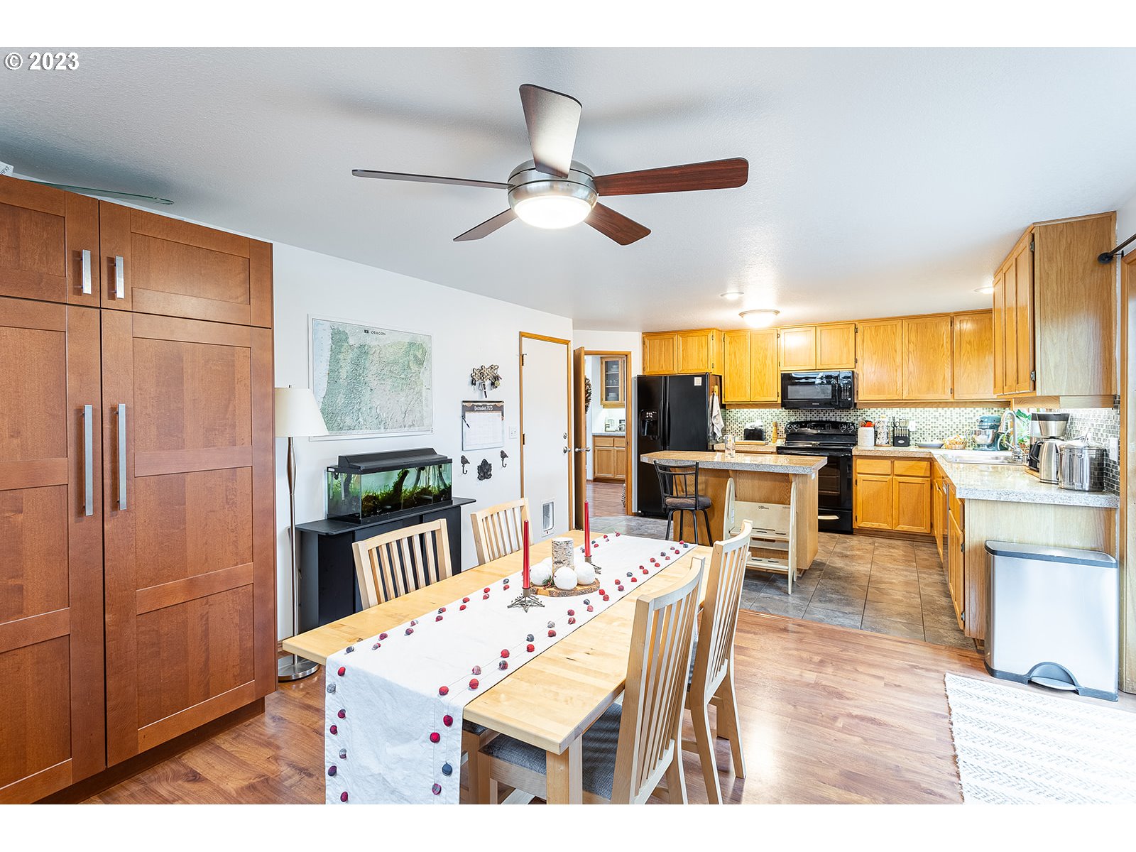 4010 Torrington Avenue Eugene, OR 97404 - Photo 15 of 35 a dining room with stainless steel appliances kitchen island granite countertop a dining table and chairs