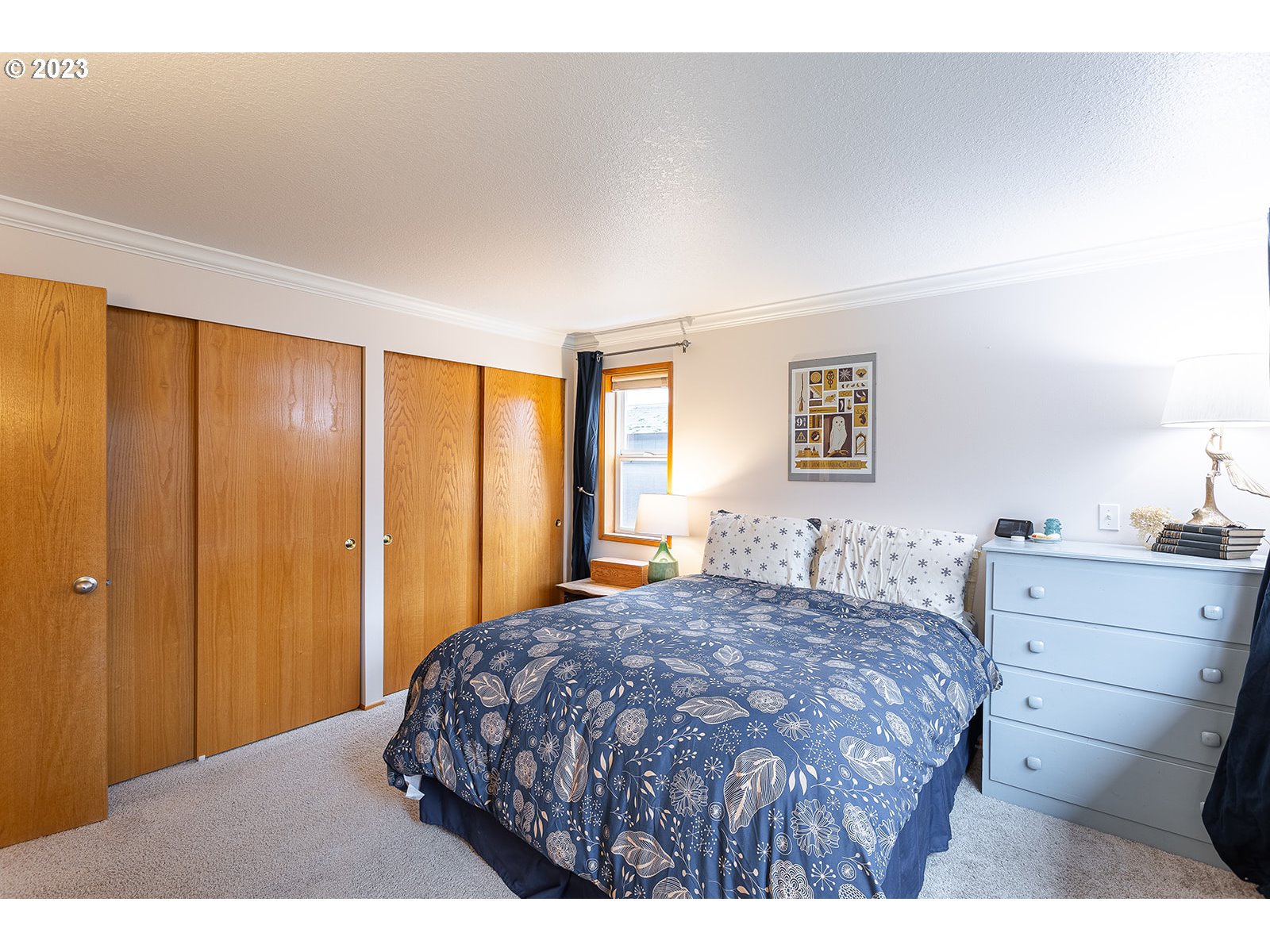 4010 Torrington Avenue Eugene, OR 97404 - Photo 21 of 35 a bedroom with a bed and a dresser