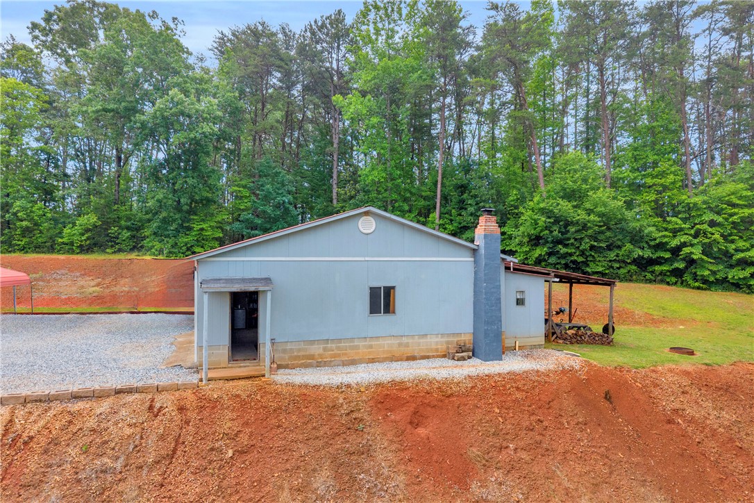 721 Cedar Crest Trail Walhalla, SC 29691 - Photo 31 of 47 A quaint residence nestled among verdant trees, offering a private, rural setting.