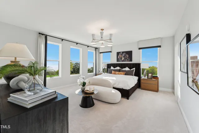 a bedroom with bed and window