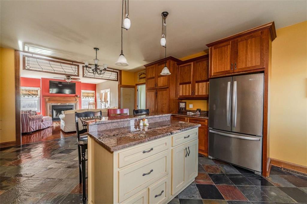 6729 Big Texas Valley Road Northwest Rome, GA 30165 - Photo 14 of 32 a kitchen with stainless steel appliances granite countertop a refrigerator a oven and a sink with granite countertops