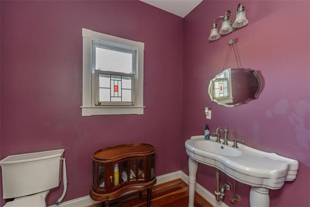 6729 Big Texas Valley Road Northwest Rome, GA 30165 - Photo 15 of 32 a bathroom with a sink a mirror and a toilet