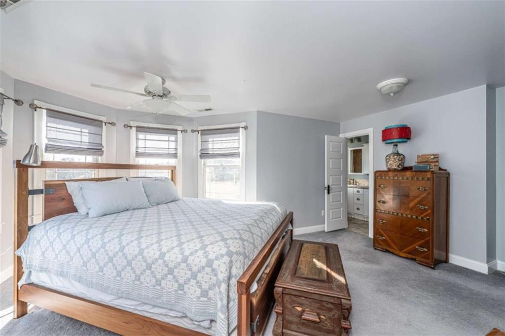 6729 Big Texas Valley Road Northwest Rome, GA 30165 - Photo 18 of 32 a bedroom with a bed and a window