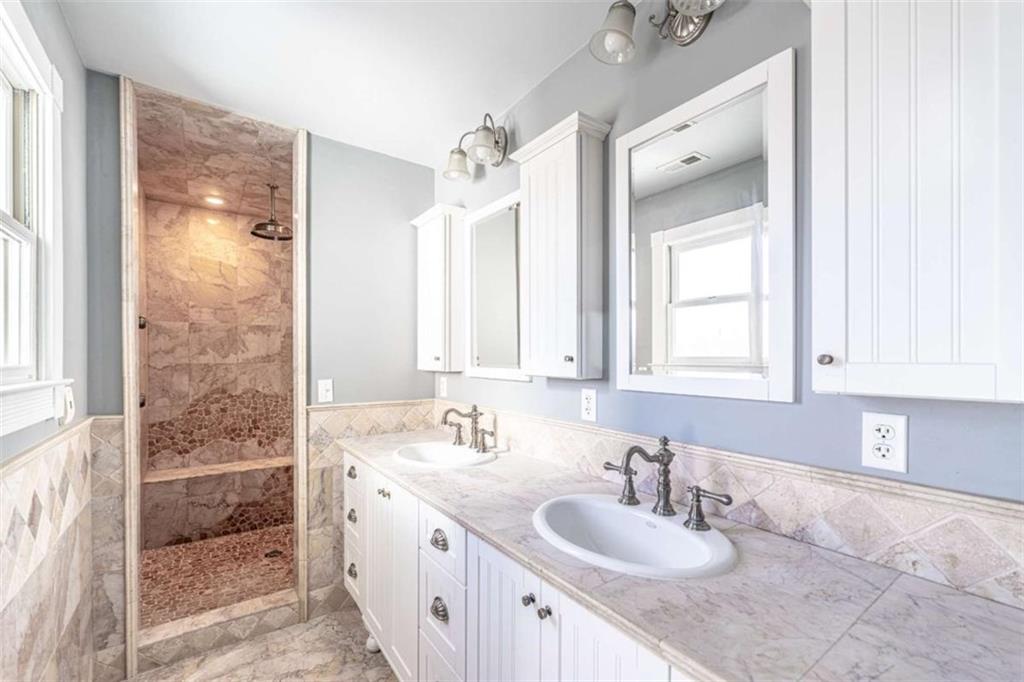 6729 Big Texas Valley Road Northwest Rome, GA 30165 - Photo 19 of 32 a bathroom with a granite countertop sink and a mirror