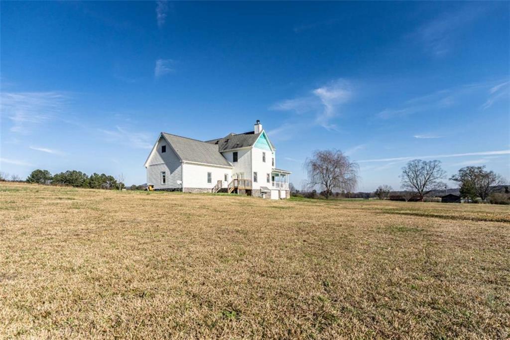 6729 Big Texas Valley Road Northwest Rome, GA 30165 - Photo 2 of 32 a house with lake view