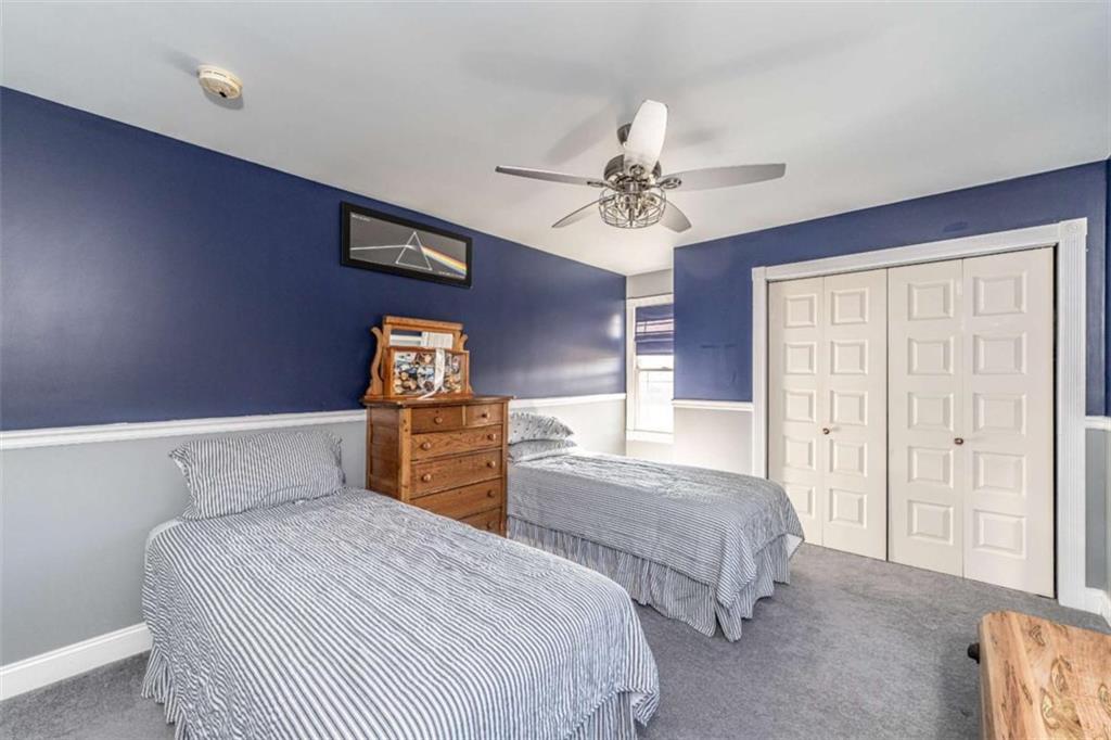 6729 Big Texas Valley Road Northwest Rome, GA 30165 - Photo 23 of 32 a bedroom with a bed and a chandelier