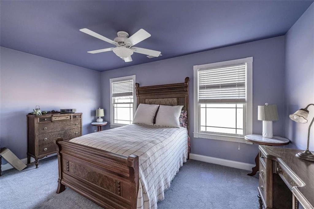 6729 Big Texas Valley Road Northwest Rome, GA 30165 - Photo 24 of 32 a bedroom with a bed and a chandelier