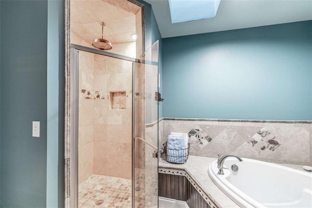 6729 Big Texas Valley Road Northwest Rome, GA 30165 - Photo 27 of 32 a bathroom with a bathtub and shower