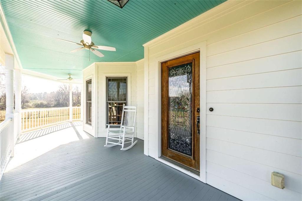 6729 Big Texas Valley Road Northwest Rome, GA 30165 - Photo 31 of 32 a view of a livingroom with wooden floor and a large window