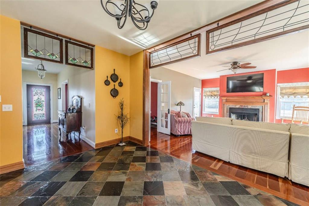 6729 Big Texas Valley Road Northwest Rome, GA 30165 - Photo 9 of 32 a living room with furniture and a fireplace