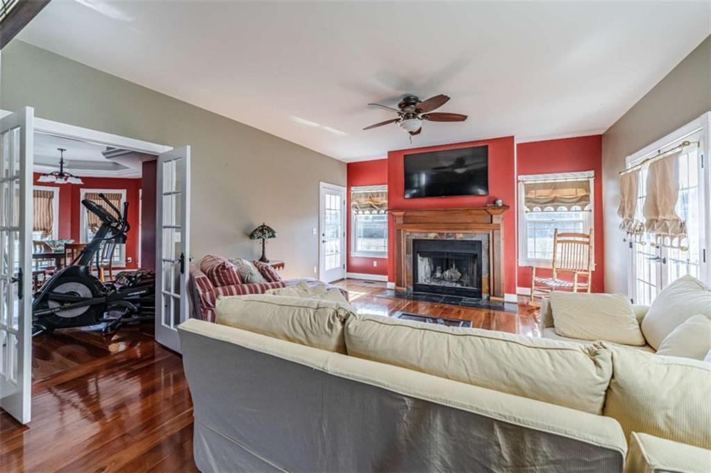 6729 Big Texas Valley Road Northwest Rome, GA 30165 - Photo 10 of 32 a living room with furniture and a fireplace