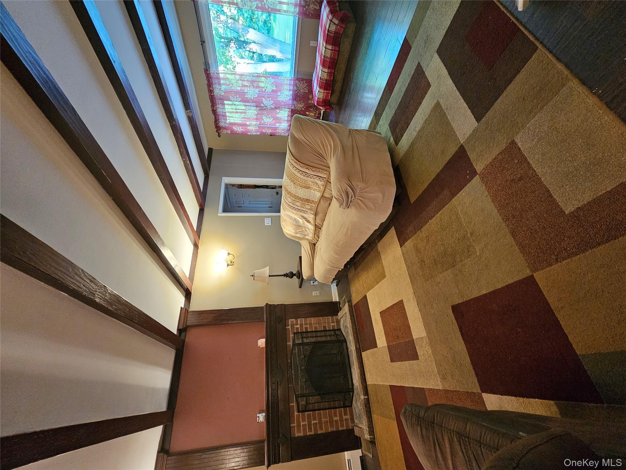 2431 Albany Post Road Montgomery, NY 12586 - Photo 15 of 44 a living room with a couch and a flat screen tv