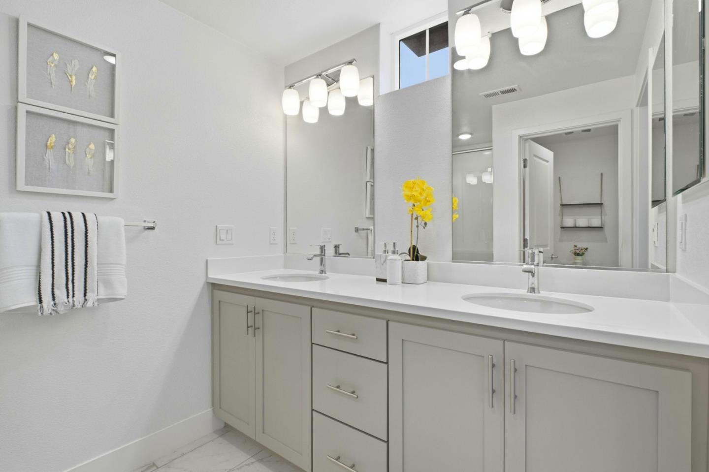 385 Line Street Hayward, CA 94544 - Photo 24 of 38 a bathroom with a double vanity sink and a mirror