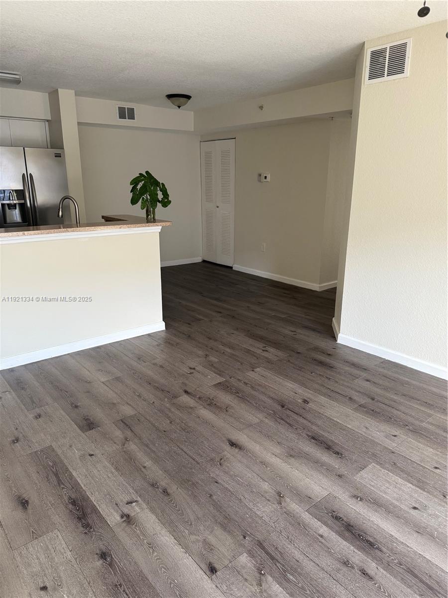15422 Southwest 284th Street, Unit 7202 Homestead, FL 33033 - Photo 3 of 13 a view of a room with wooden floor and sink