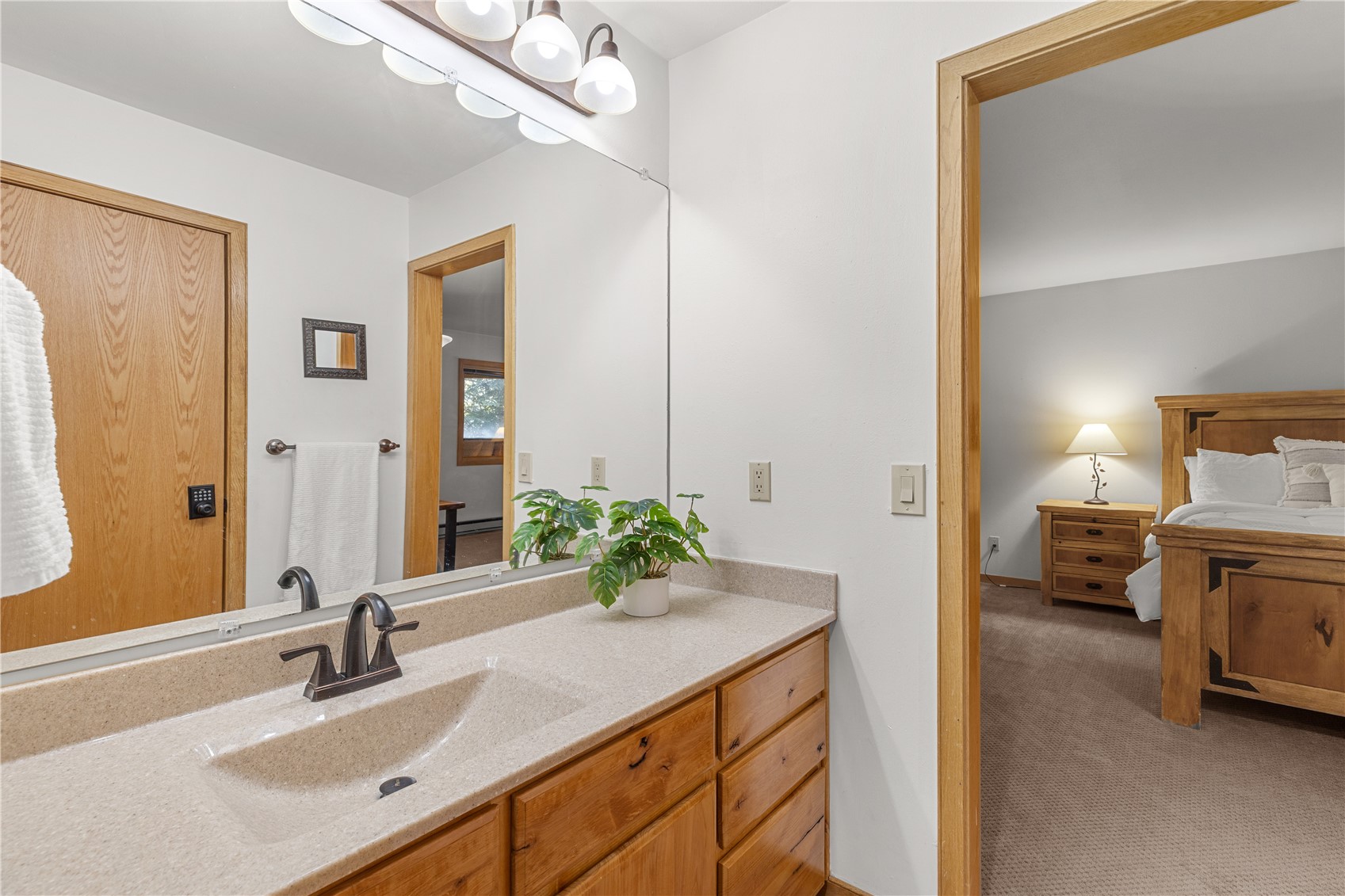 22804 Highway 6, Unit 102 Keystone, CO 80435 - Photo 16 of 34 a en suite bathroom with a sink and a mirror