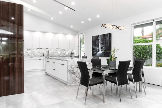 a kitchen with granite countertop a refrigerator and a stove