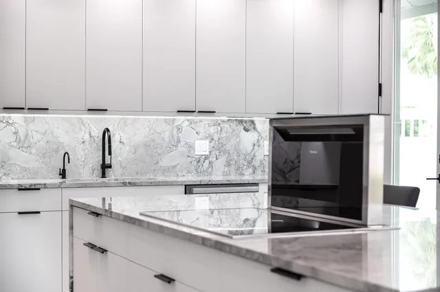 a living room with furniture ceiling fan and a flat screen tv