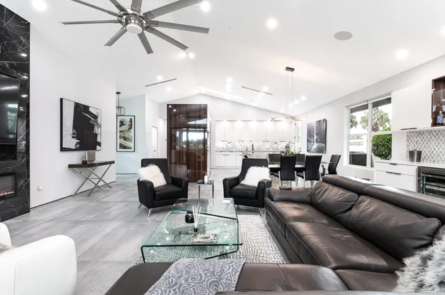 a bathroom with a bathtub a sink and a large mirror