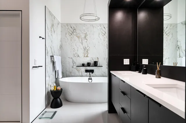 a bathroom with a sink a shower and a mirror