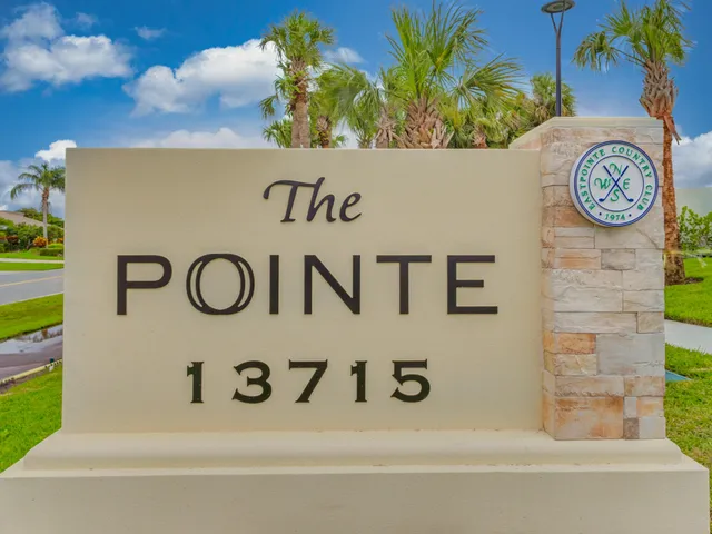 a view of a swimming pool with outdoor seating