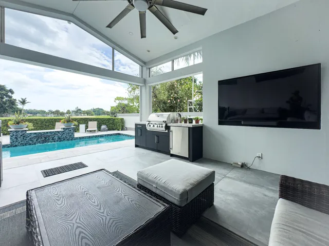 a view of a lake with a patio and a garden