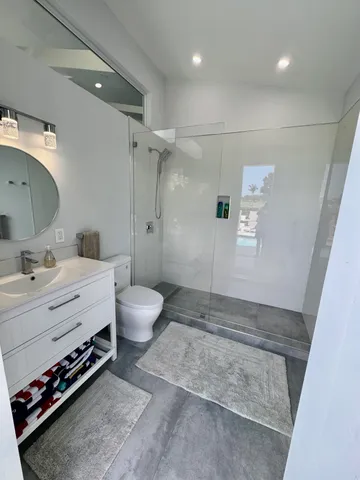 a bathroom with a bathtub and a shower