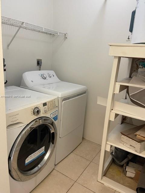 2931 Southwest 87th Terrace, Unit 1923 Davie, FL 33328 - Photo 12 of 15 a utility room with dryer and washer