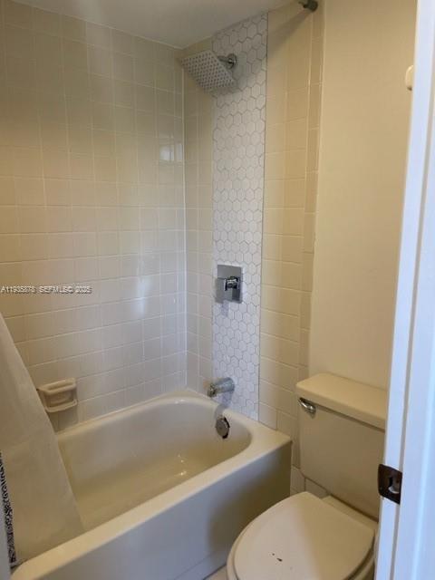 2931 Southwest 87th Terrace, Unit 1923 Davie, FL 33328 - Photo 14 of 15 a white bath tub sitting next to a toilet