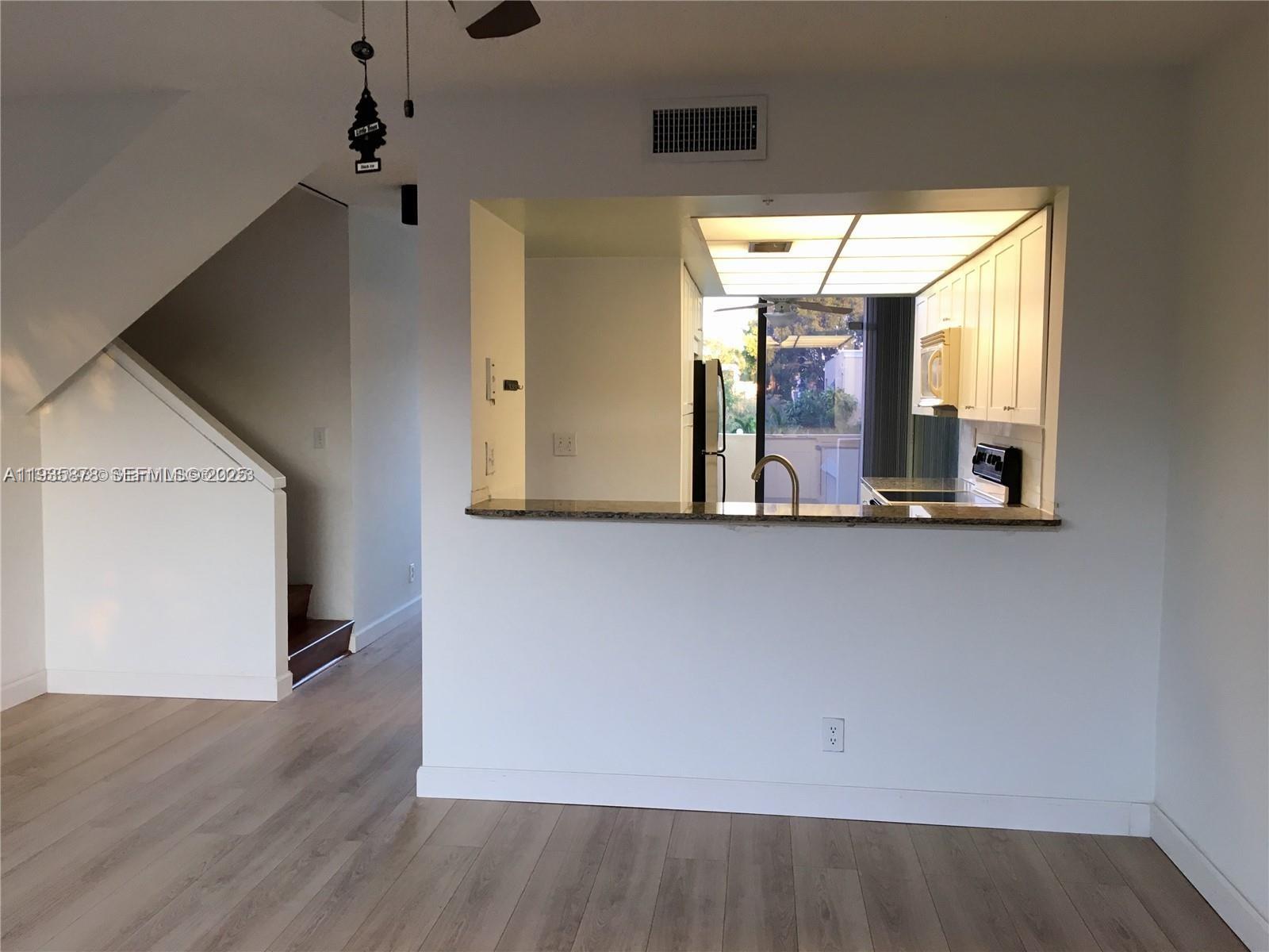 2931 Southwest 87th Terrace, Unit 1923 Davie, FL 33328 - Photo 8 of 15 a view of an entryway with wooden floor