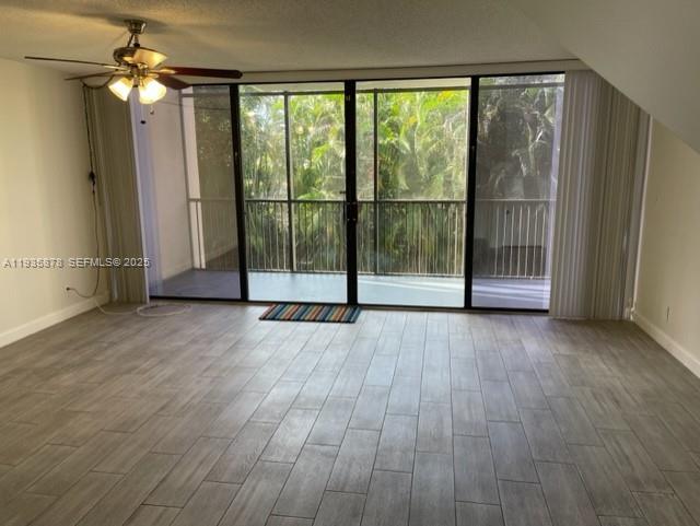 2931 Southwest 87th Terrace, Unit 1923 Davie, FL 33328 - Photo 9 of 15 a view of a room with wooden floor and balcony