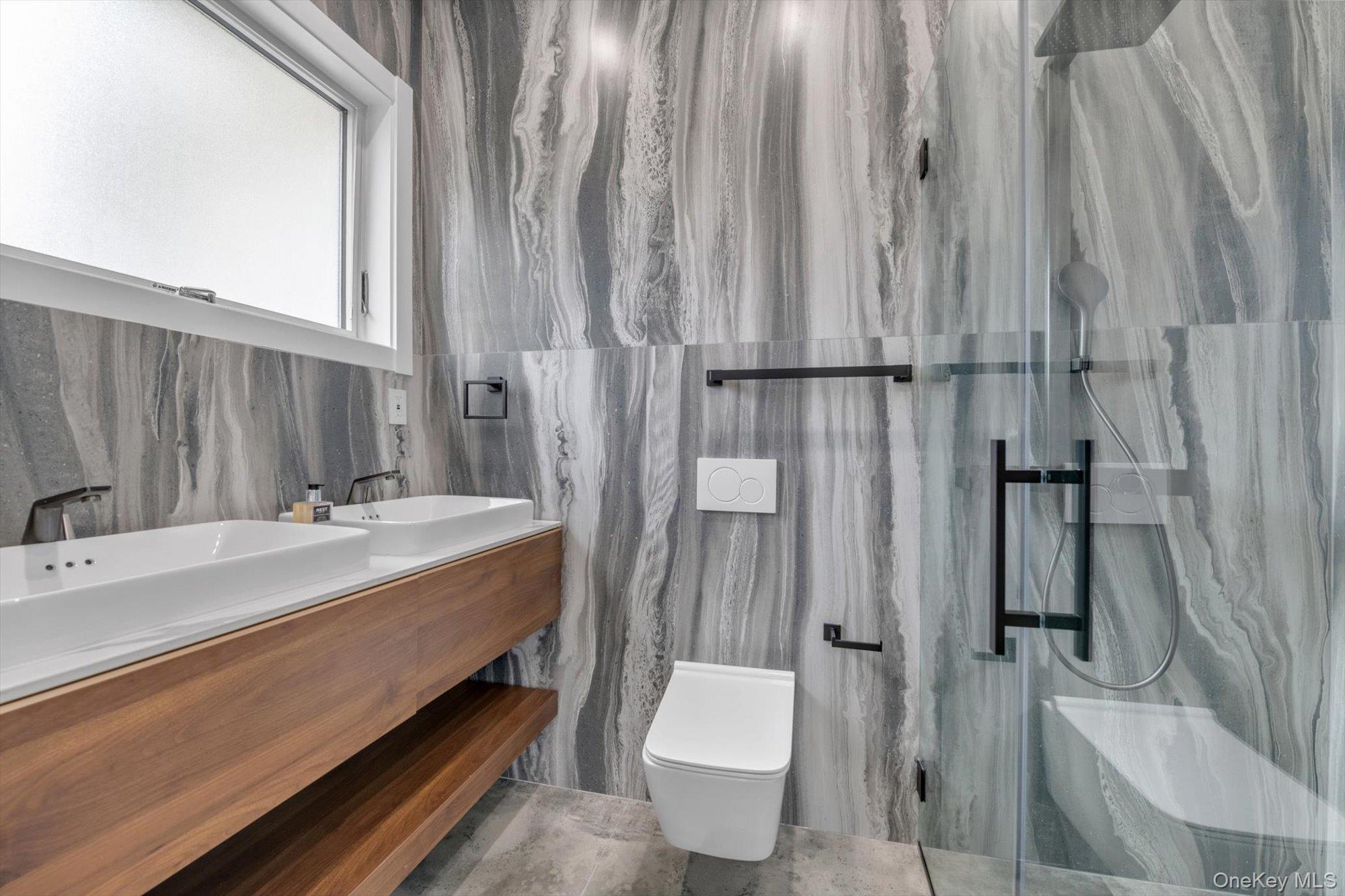190 Curtis Road Woodmere, NY 11598 - Photo 17 of 46 a bathroom with a double vanity sink toilet and shower