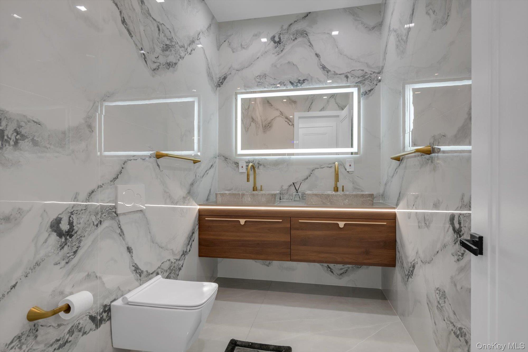 190 Curtis Road Woodmere, NY 11598 - Photo 18 of 46 a bathroom with a sink mirror vanity and toilet