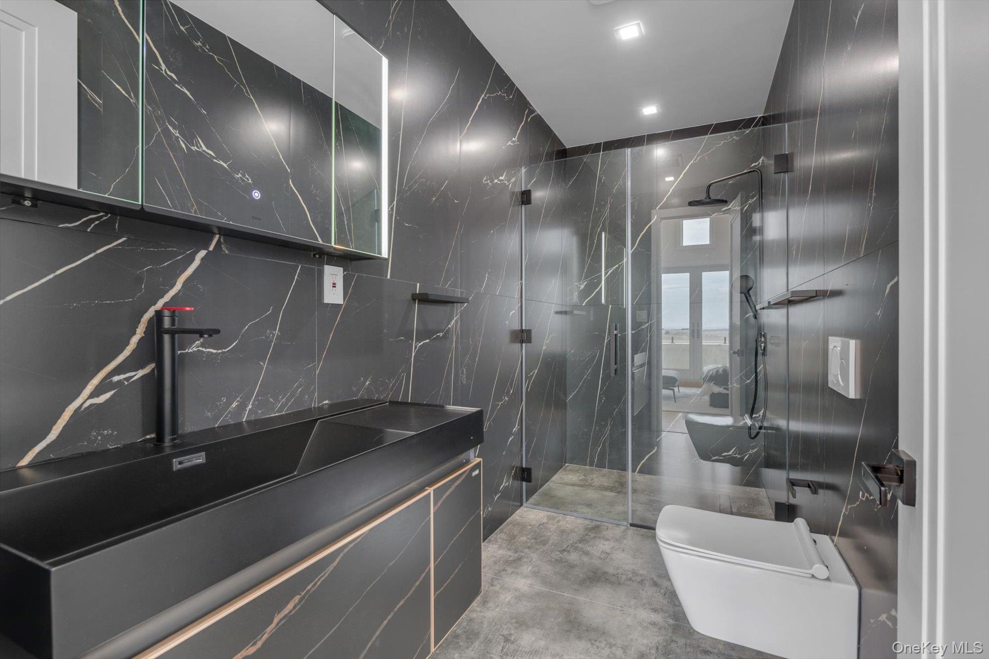 190 Curtis Road Woodmere, NY 11598 - Photo 31 of 46 a bathroom with a sink a toilet and shower