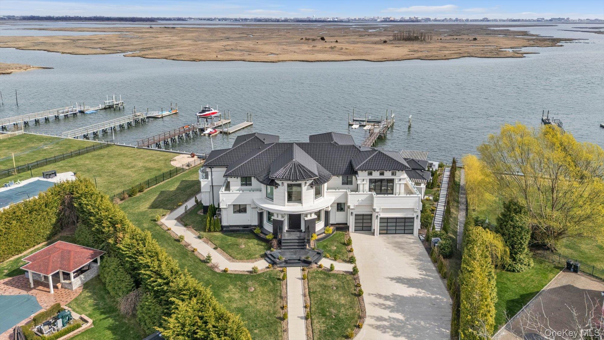 190 Curtis Road Woodmere, NY 11598 - Photo 35 of 46 a aerial view of a house with a lake view