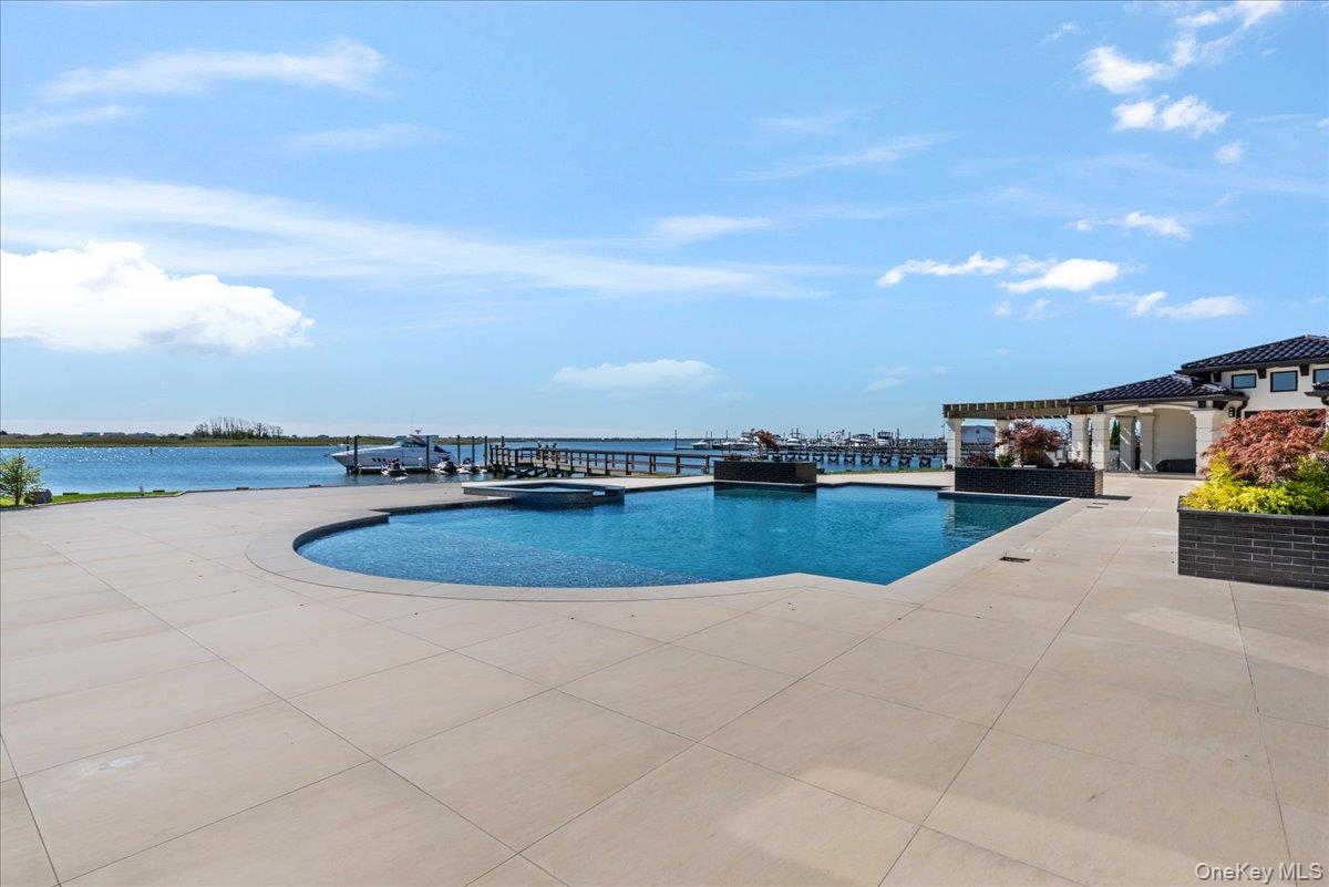 190 Curtis Road Woodmere, NY 11598 - Photo 38 of 46 a view of a swimming pool and an outdoor seating