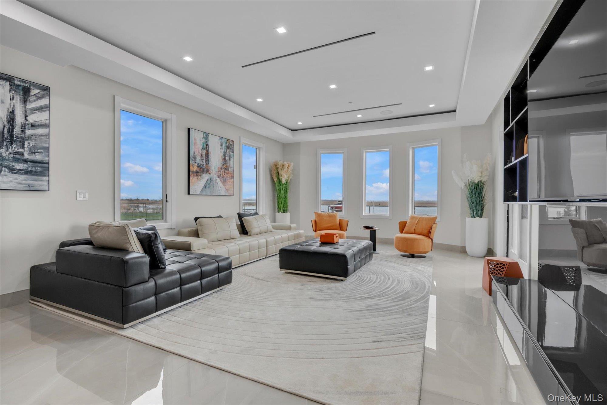 190 Curtis Road Woodmere, NY 11598 - Photo 4 of 46 a living room with furniture and a flat screen tv