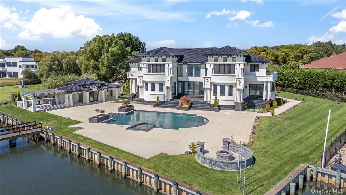 190 Curtis Road Woodmere, NY 11598 - Photo 41 of 46 a view of a house with swimming pool and sitting area