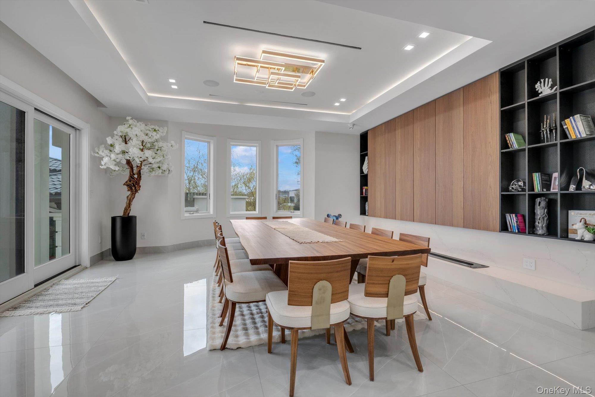190 Curtis Road Woodmere, NY 11598 - Photo 6 of 46 a dining room with furniture and chandelier