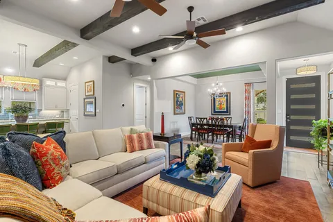 a kitchen with granite countertop kitchen island stainless steel appliances a sink stove and cabinets